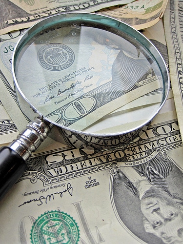 Finding new donors image of money and magnifying glass from Flickr http://www.flickr.com/photos/59937401@N07/5857462455/