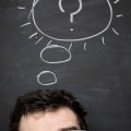 Image of a person with a question mark on a chalkboard